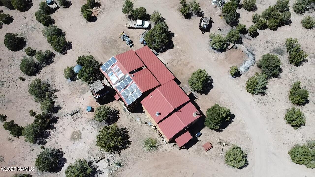 2795 Poppy Road Ash Fork, AZ 86320 - Photo 55 of 56 an aerial view of a house with a yard and pool