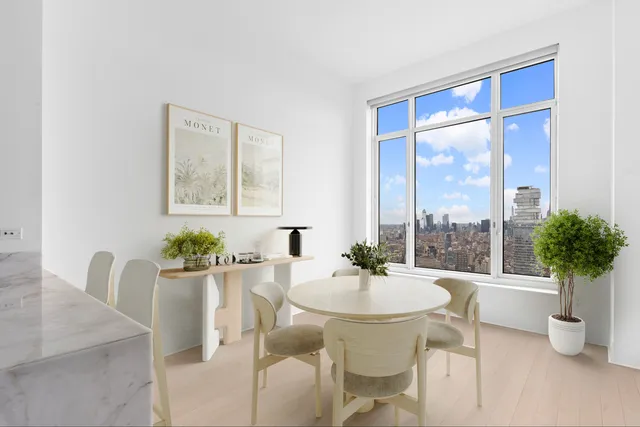 a view of a dining room with furniture window and outdoor view