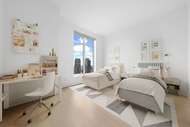 a living room with furniture and next to a window