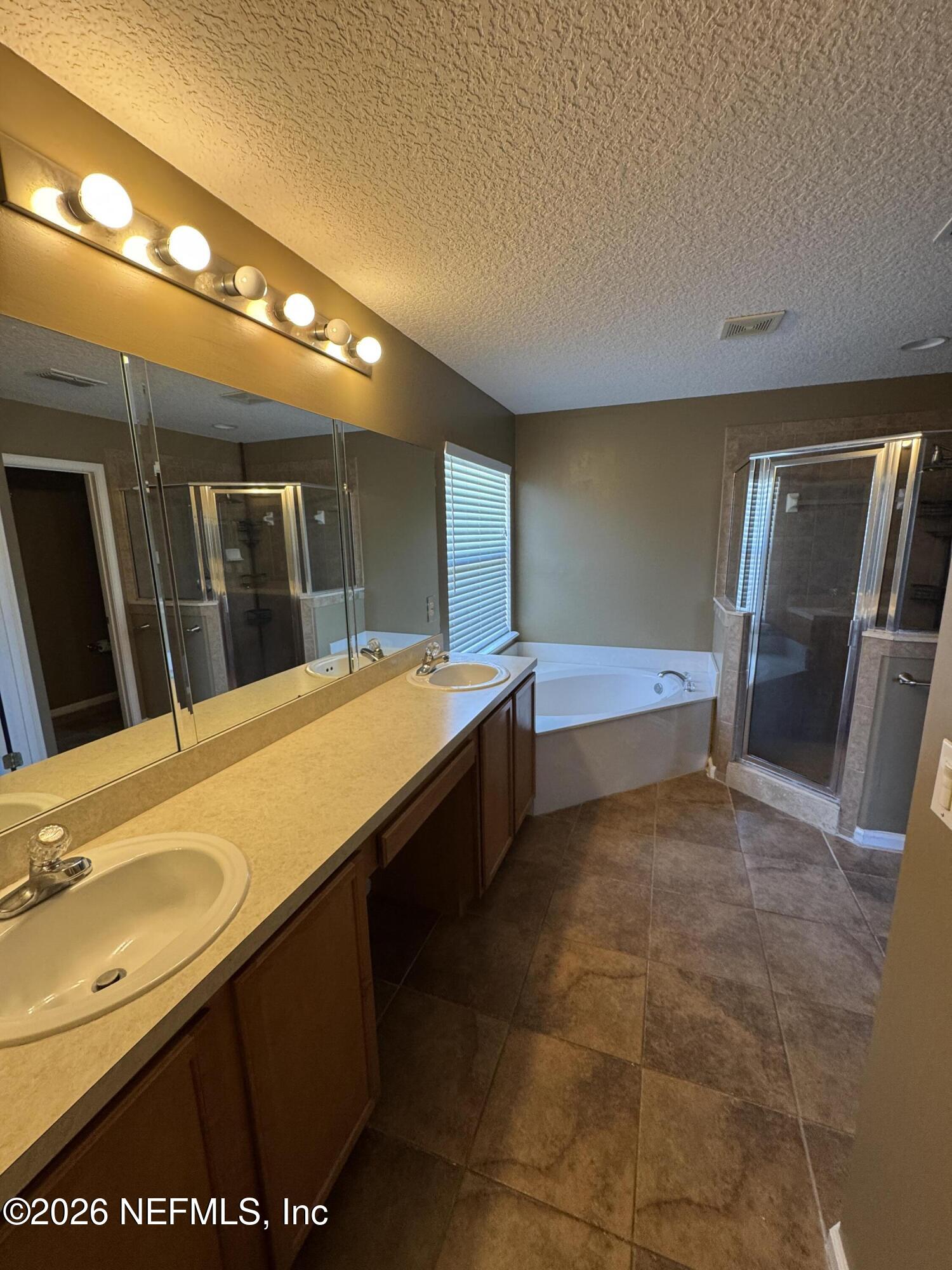 2725 Ravine Hill Drive Middleburg, FL 32068 - Photo 11 of 23 a bathroom with a sink and a large mirror