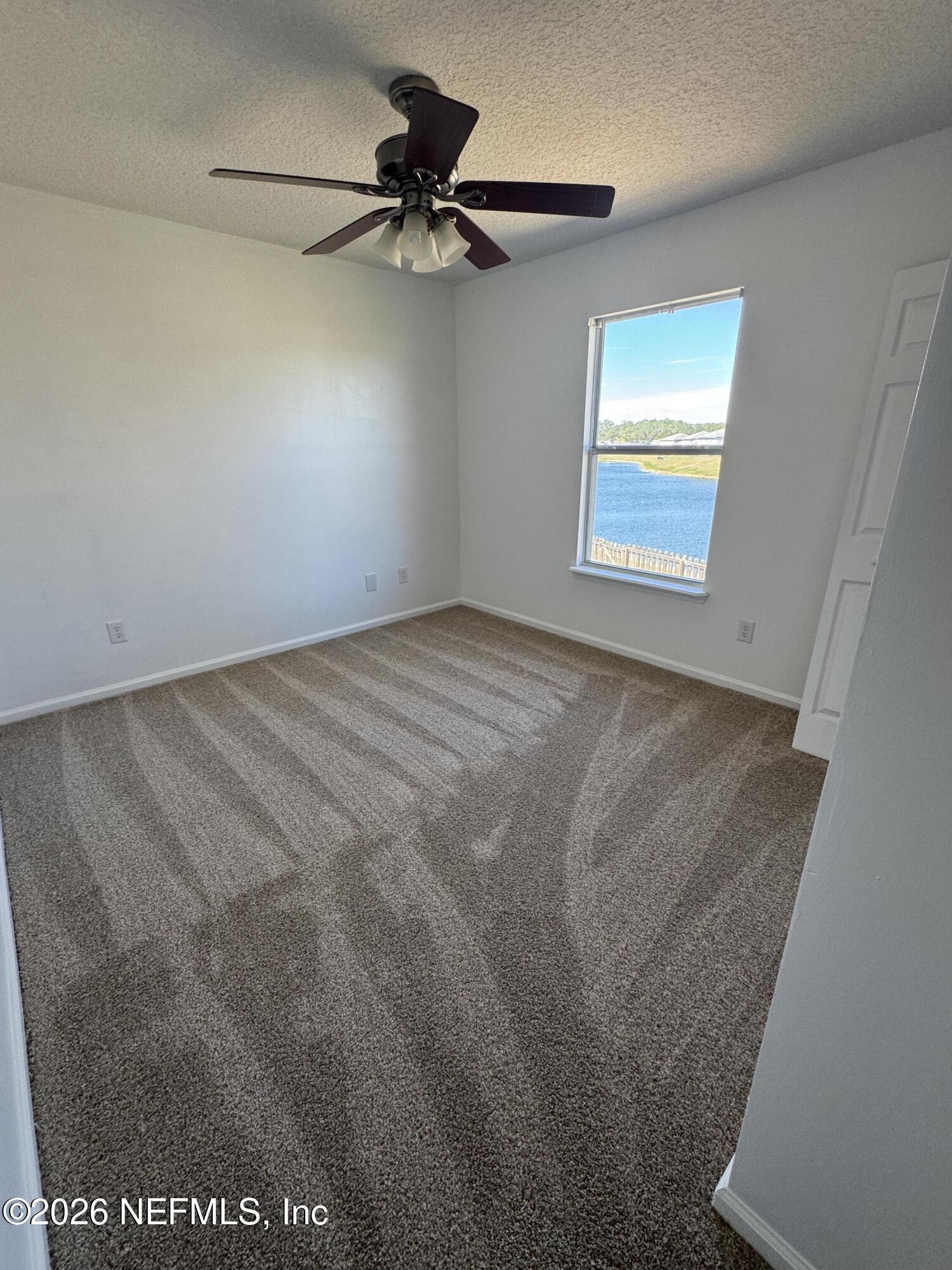 2725 Ravine Hill Drive Middleburg, FL 32068 - Photo 18 of 23 a view of a livingroom with a ceiling fan and window