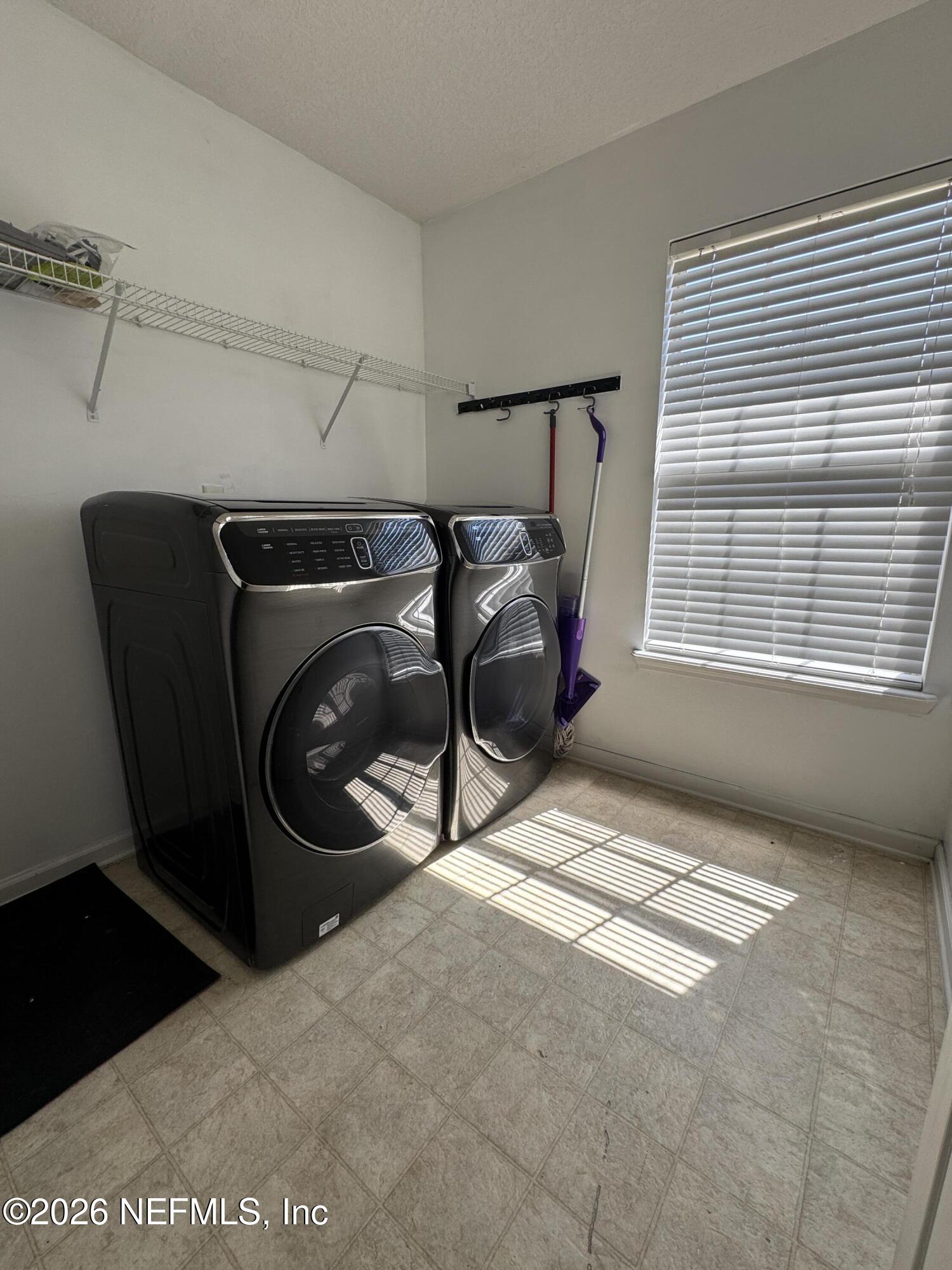 2725 Ravine Hill Drive Middleburg, FL 32068 - Photo 19 of 23 a utility room with dryer and washer