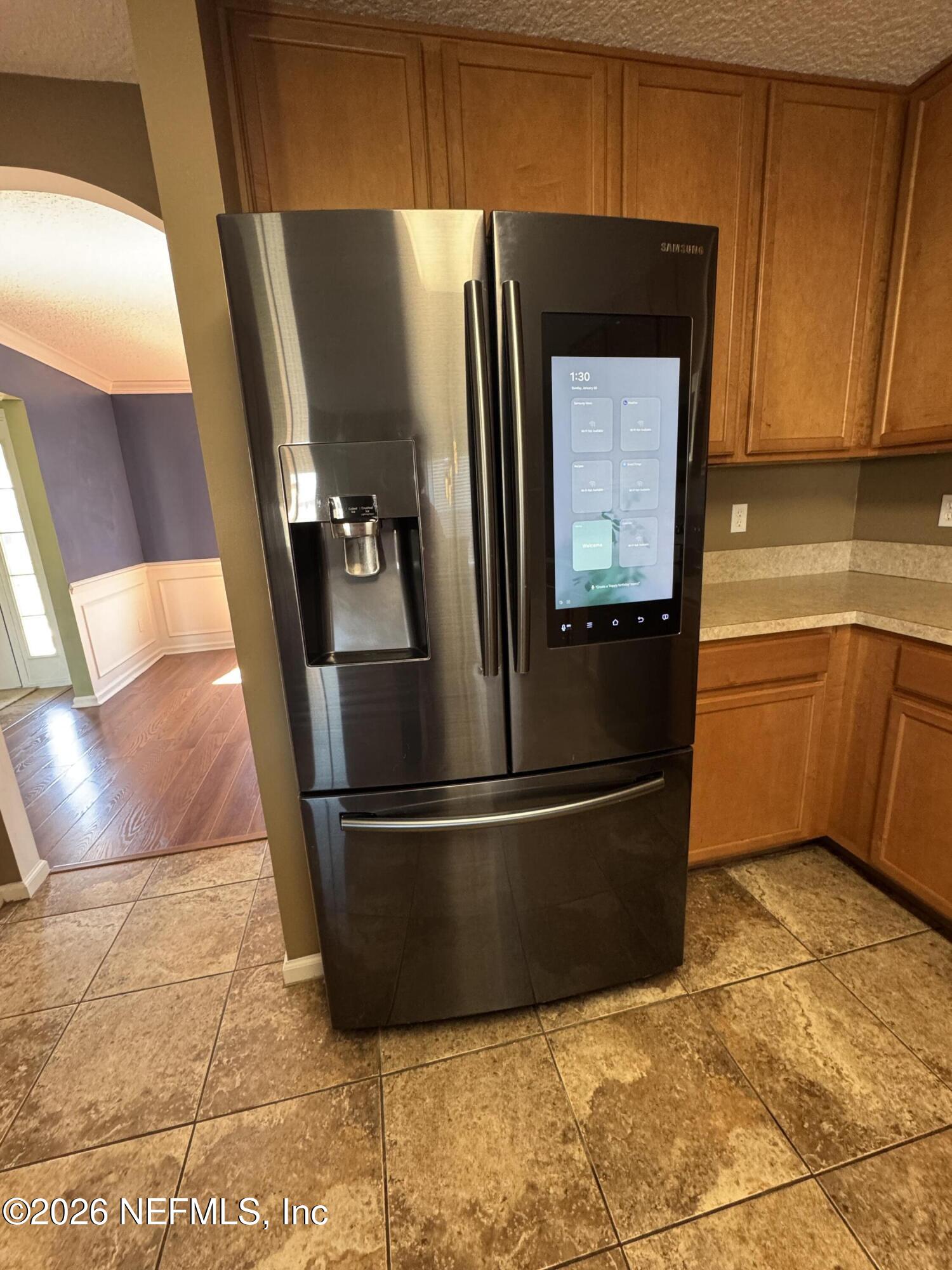 2725 Ravine Hill Drive Middleburg, FL 32068 - Photo 7 of 23 a kitchen with stainless steel appliances granite countertop a refrigerator and a sink