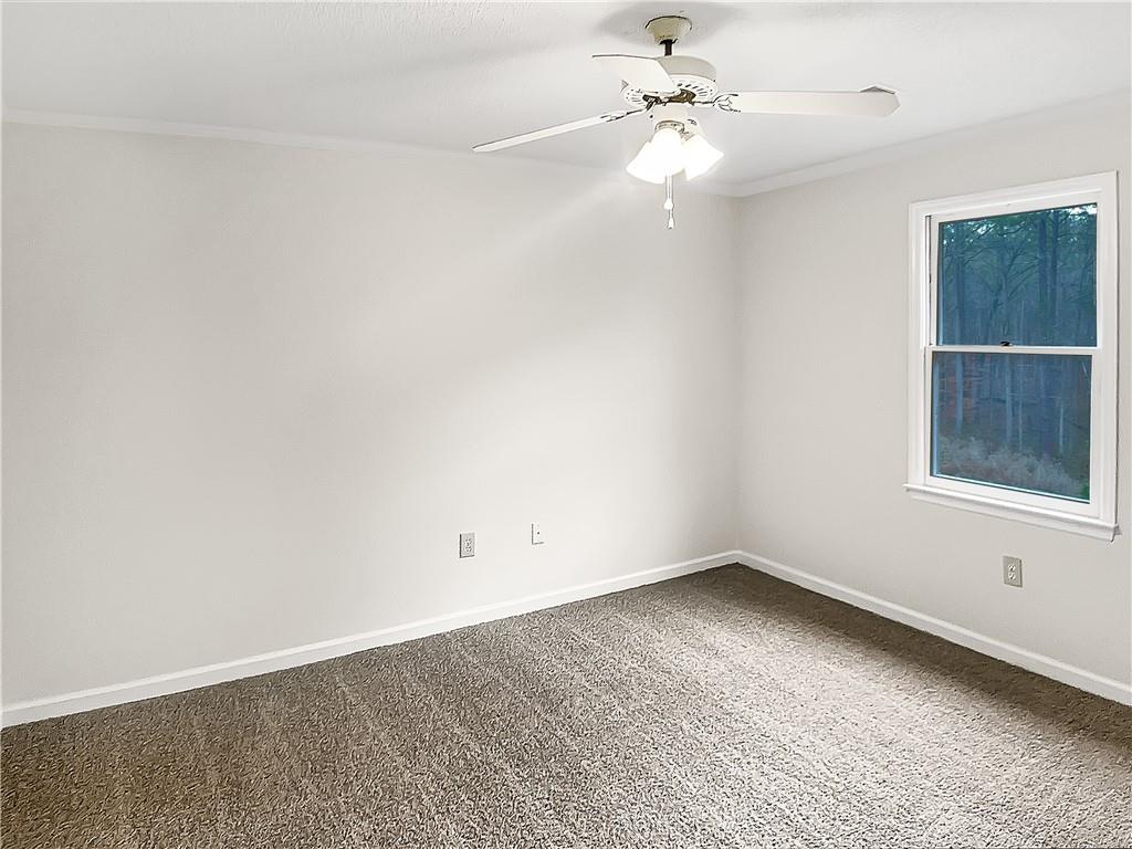 155 Ridgeview Drive Athens, GA 30606 - Photo 13 of 23 an empty room with a window and a ceiling fan