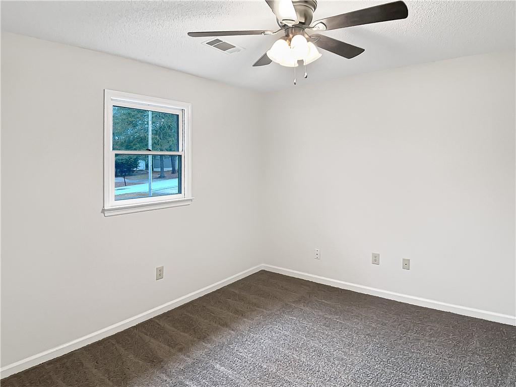 155 Ridgeview Drive Athens, GA 30606 - Photo 14 of 23 an empty room with a window and a fan
