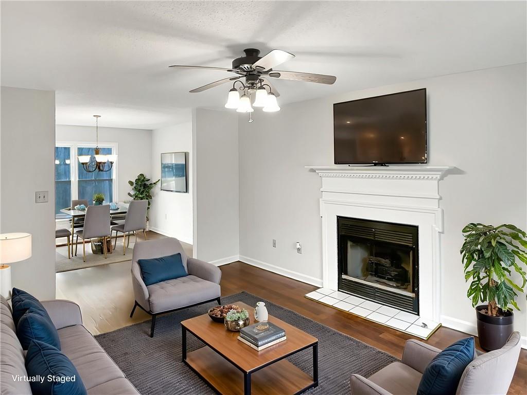 155 Ridgeview Drive Athens, GA 30606 - Photo 3 of 23 a living room with furniture a flat screen tv and a fireplace