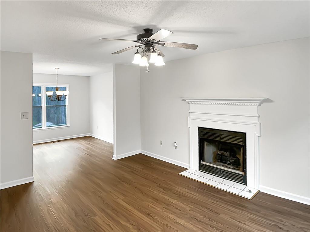 155 Ridgeview Drive Athens, GA 30606 - Photo 4 of 23 a view of a livingroom with a fireplace and wooden floor