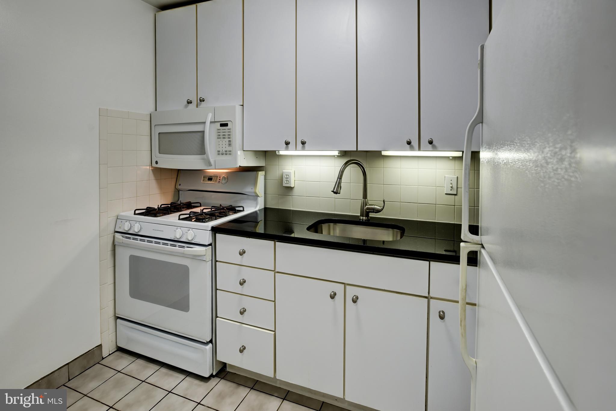 2401 H Street Northwest, Unit 208 Washington, DC 20037 - Photo 6 of 37 Updated Kitchen with Granite countertops