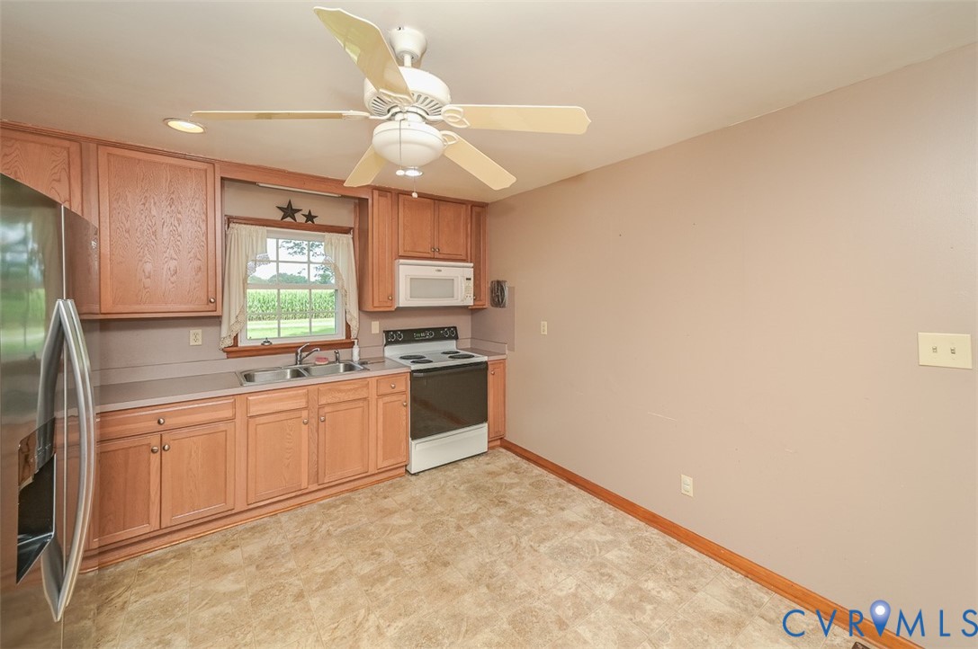581 Smokey Road Aylett, VA 23009 - Photo 12 of 28 Kitchen featuring wood-finish cabinetry, a stainle