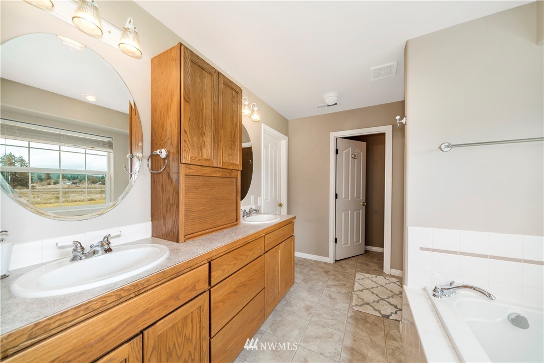 18828 Nutmeg Street Southwest Rochester, WA 98579 - Photo 15 of 25 a bathroom with a sink and a mirror