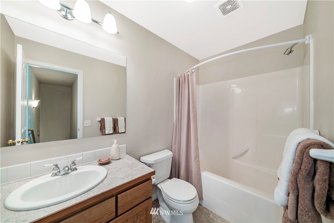 18828 Nutmeg Street Southwest Rochester, WA 98579 - Photo 18 of 25 a bathroom with a sink a toilet and shower