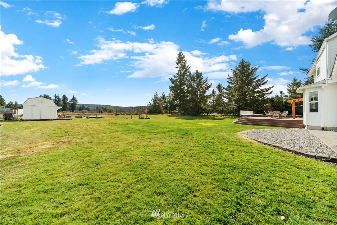 18828 Nutmeg Street Southwest Rochester, WA 98579 - Photo 22 of 25 a view of yard with swimming pool and green space