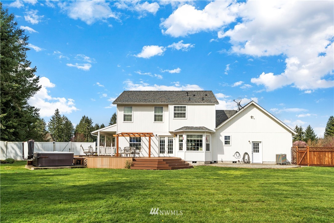 18828 Nutmeg Street Southwest Rochester, WA 98579 - Photo 23 of 25 a front view of a house with a garden and yard