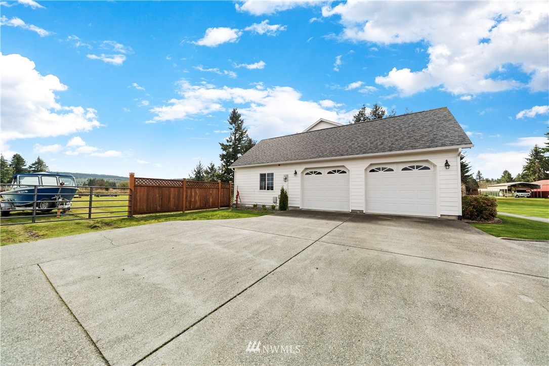 18828 Nutmeg Street Southwest Rochester, WA 98579 - Photo 25 of 25 a view of a house with a yard and garage