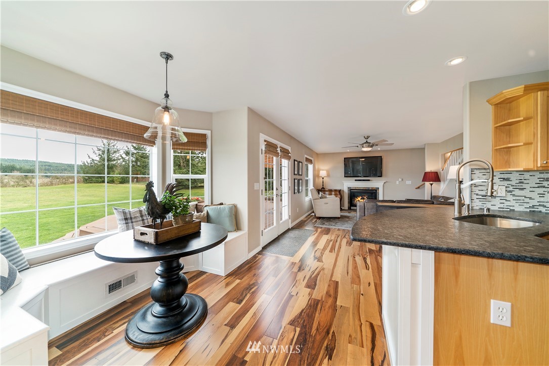 18828 Nutmeg Street Southwest Rochester, WA 98579 - Photo 7 of 25 a kitchen with a stove and a view of living room