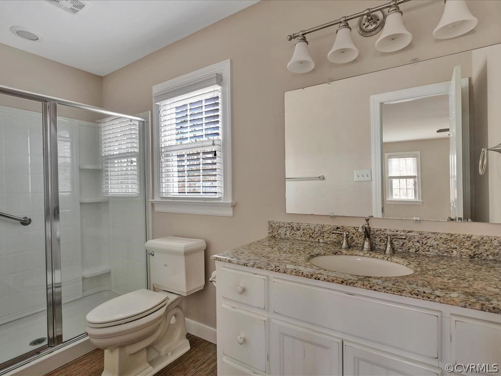 2251 Winterfield Road Midlothian, VA 23113 - Photo 15 of 27 a bathroom with a granite countertop sink toilet and shower