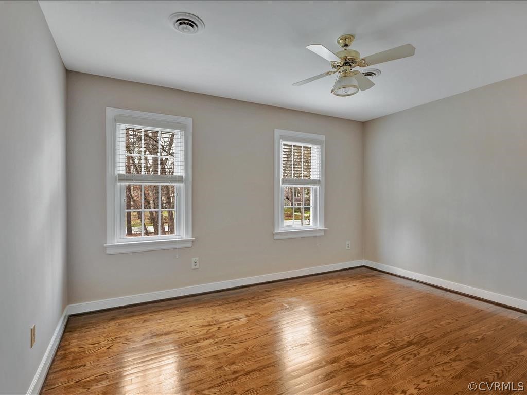 2251 Winterfield Road Midlothian, VA 23113 - Photo 19 of 27 a view of an empty room with a window and wooden floor