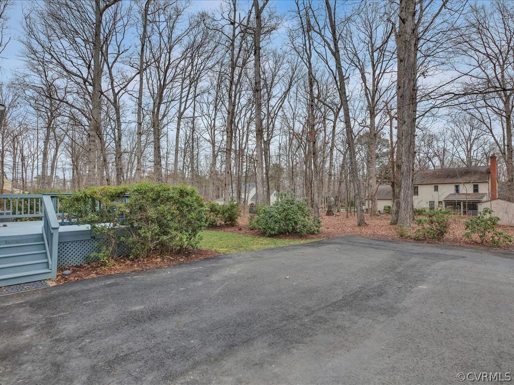 2251 Winterfield Road Midlothian, VA 23113 - Photo 26 of 27 a backyard of a house with lots of green space