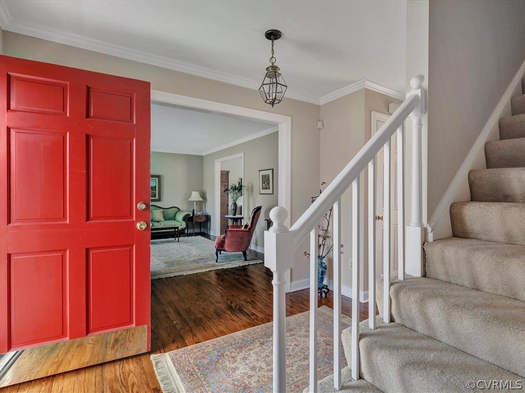 2251 Winterfield Road Midlothian, VA 23113 - Photo 3 of 27 a view of entryway dining room and hall with wooden floor