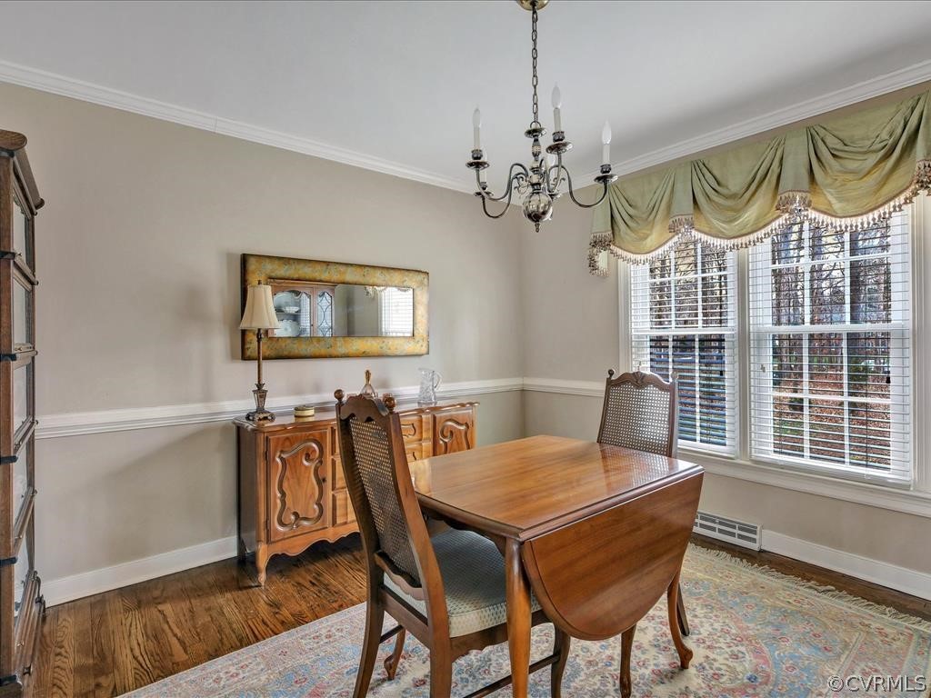 2251 Winterfield Road Midlothian, VA 23113 - Photo 6 of 27 a view of a dining room with furniture window and wooden floor