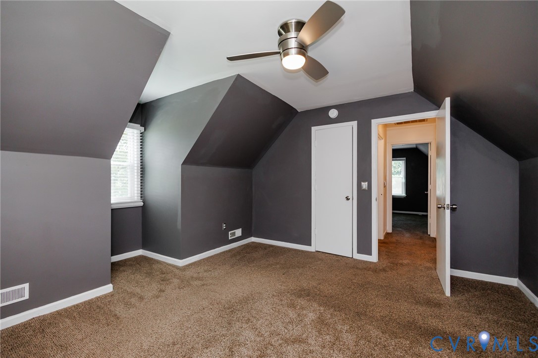 20520 Cox Road Sutherland, VA 23885 - Photo 19 of 31 Sloped ceilings, wall-to-wall carpeting, white win