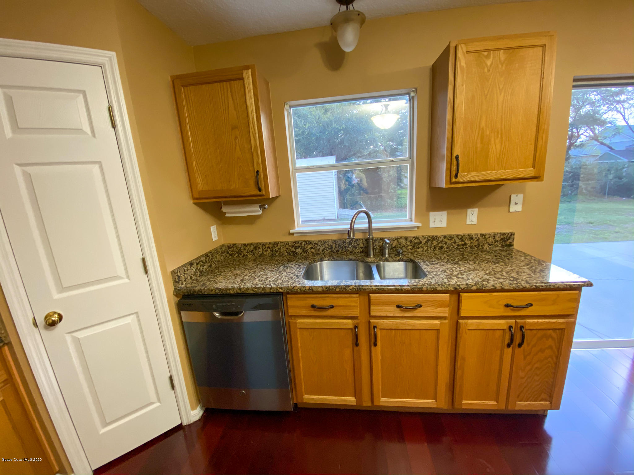 6150 Degan Road Cocoa, FL 32927 - Photo 15 of 48 a bathroom with a sink a mirror and vanity