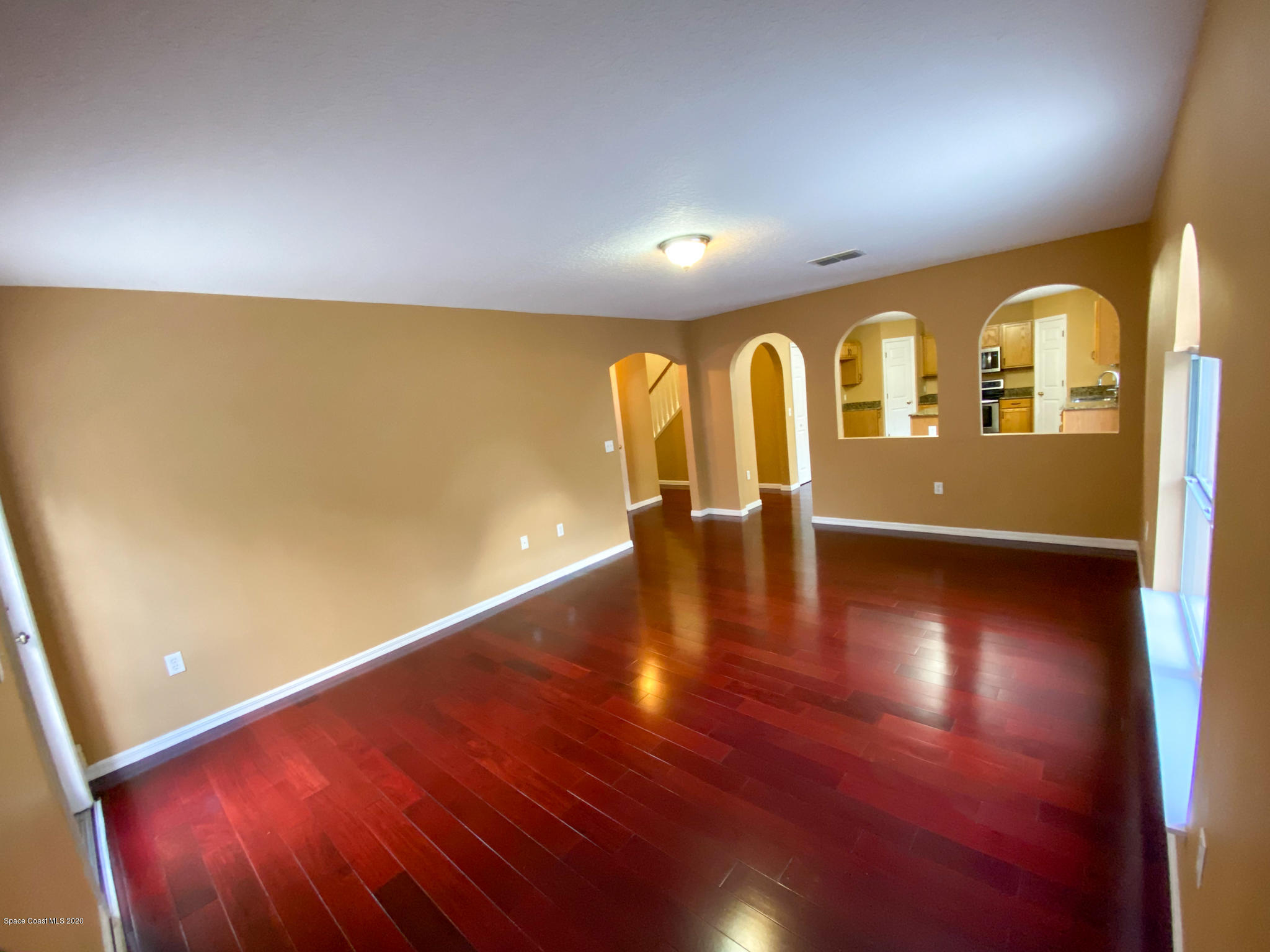 6150 Degan Road Cocoa, FL 32927 - Photo 20 of 48 a view of an empty room with wooden floor
