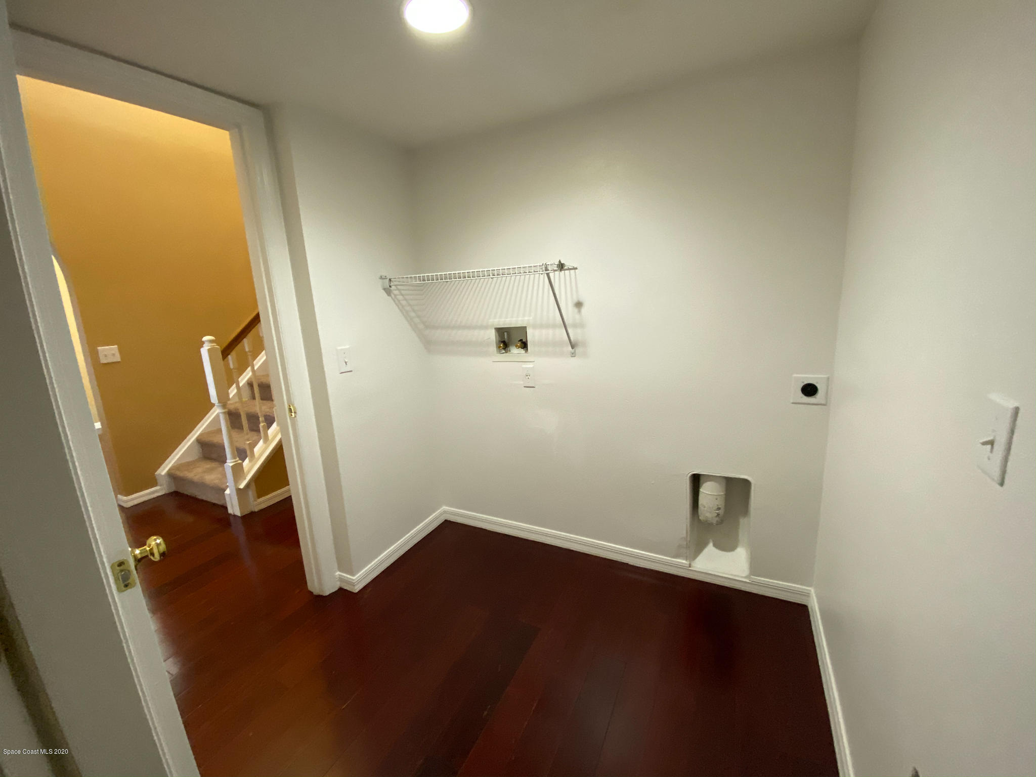 6150 Degan Road Cocoa, FL 32927 - Photo 27 of 48 an empty room with wooden floor and windows