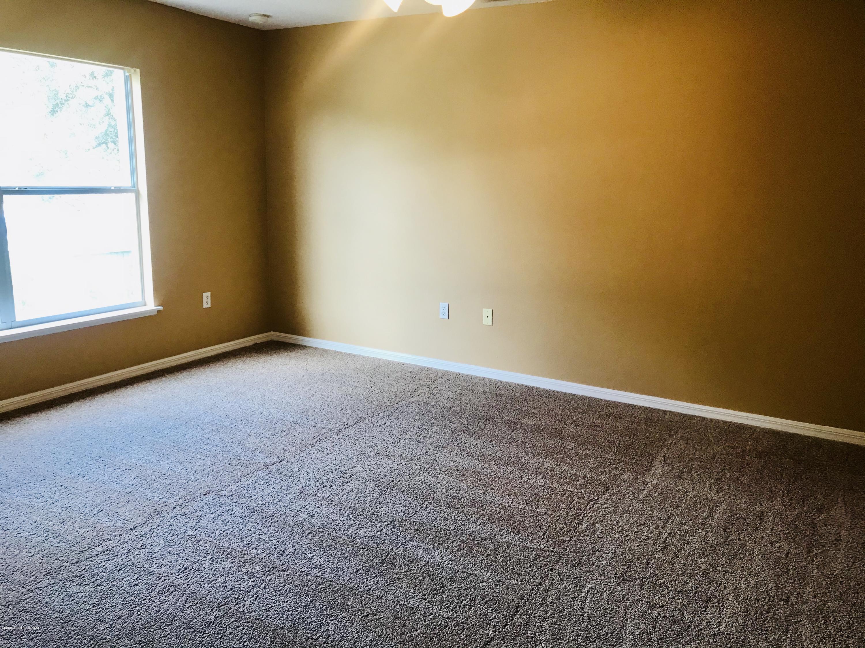6150 Degan Road Cocoa, FL 32927 - Photo 32 of 48 a view of an empty room with a window