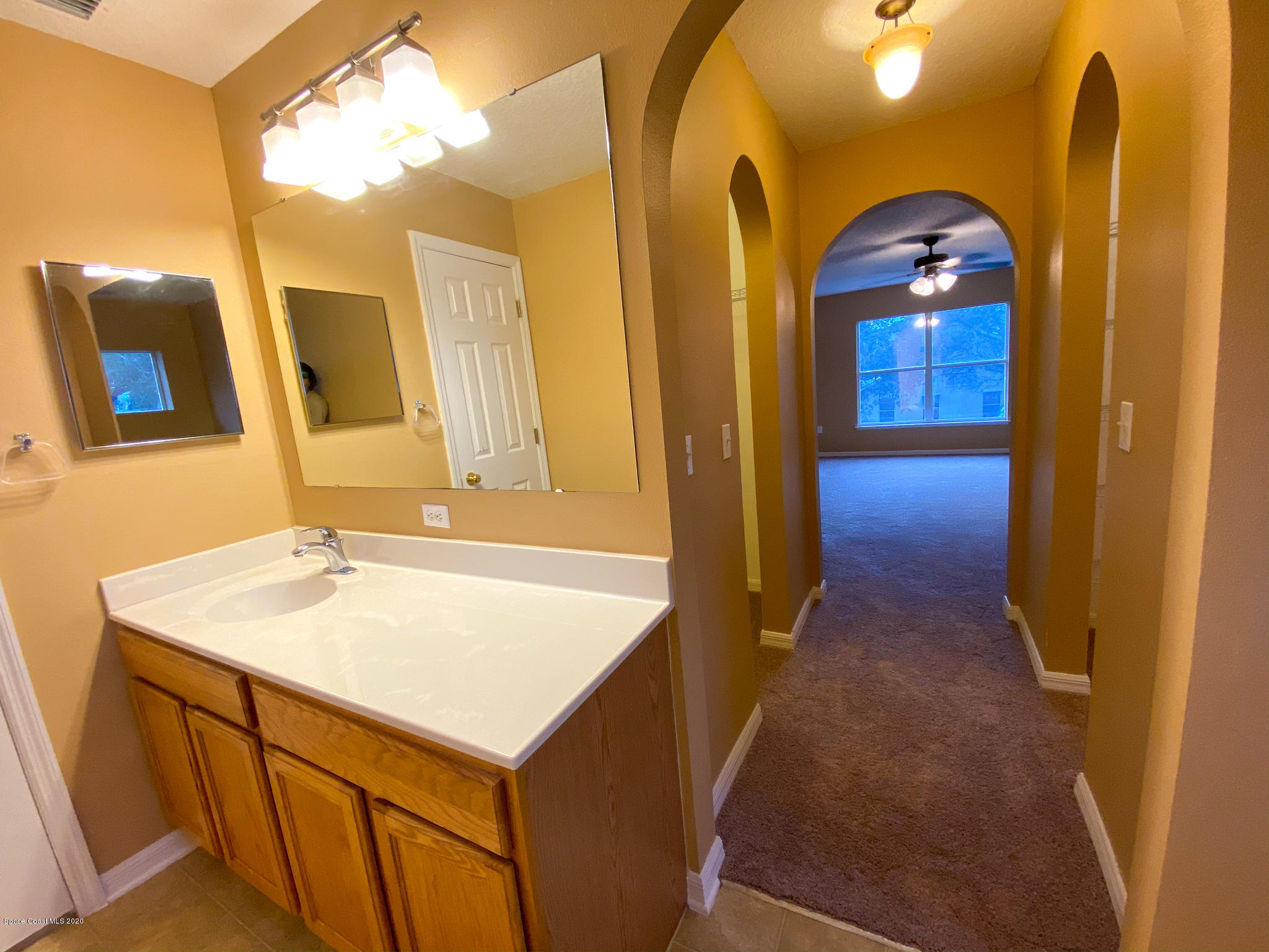 6150 Degan Road Cocoa, FL 32927 - Photo 35 of 48 a bathroom with a sink and a mirror