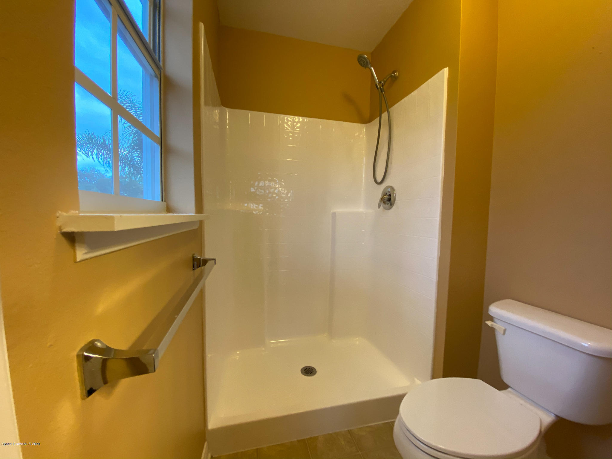 6150 Degan Road Cocoa, FL 32927 - Photo 38 of 48 a bathroom with a shower and toilet