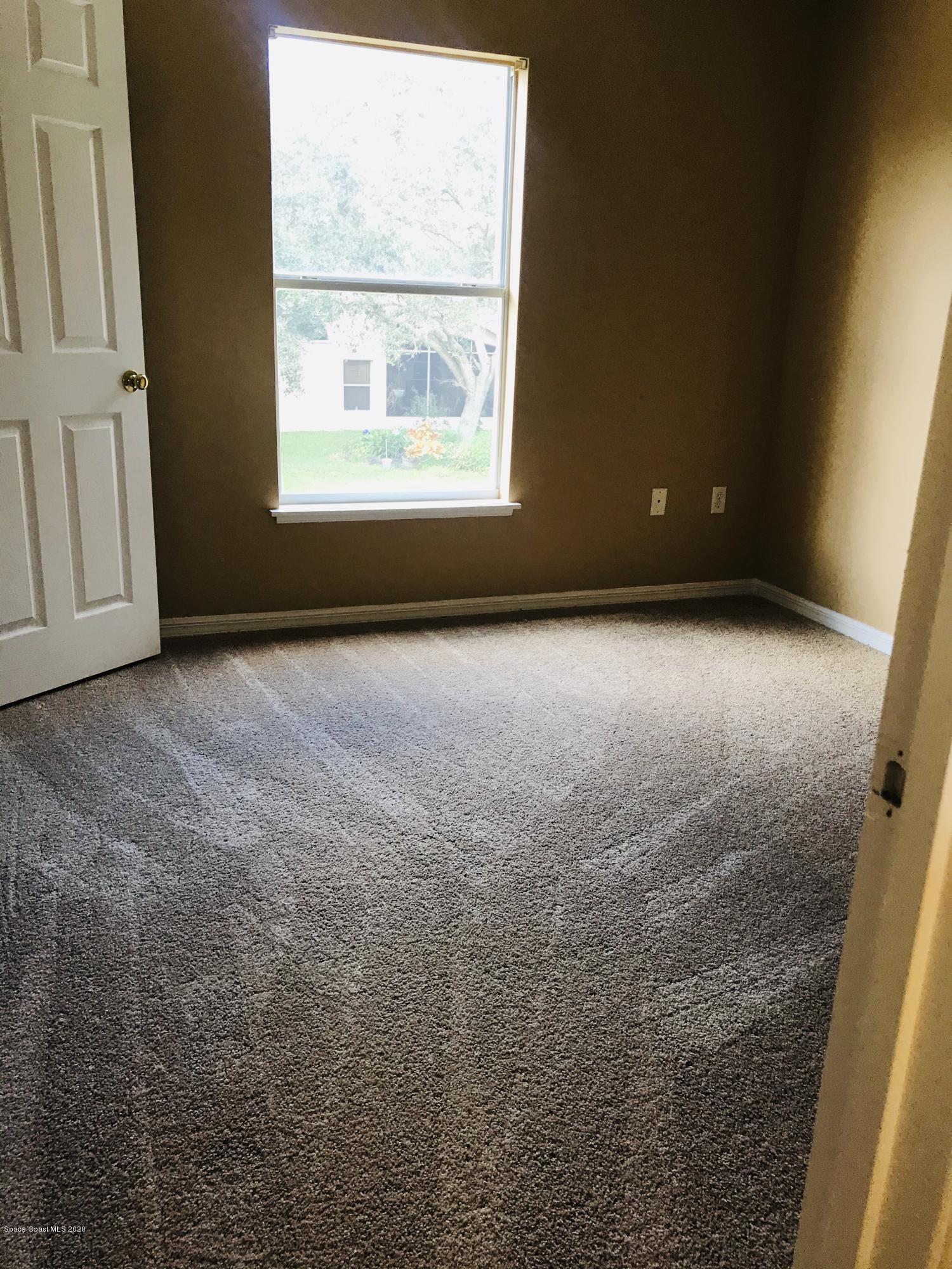 6150 Degan Road Cocoa, FL 32927 - Photo 41 of 48 an empty room with a window
