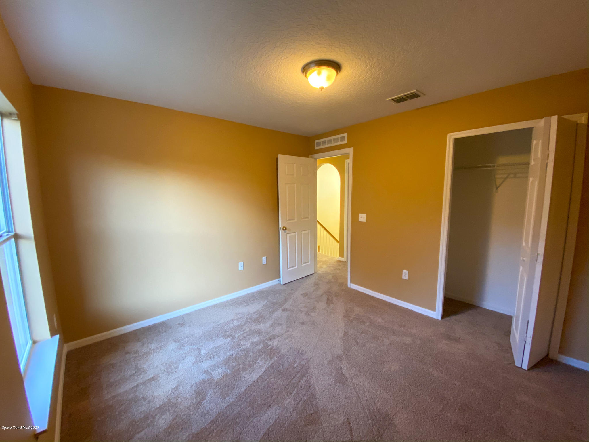 6150 Degan Road Cocoa, FL 32927 - Photo 43 of 48 an empty room with a natural light