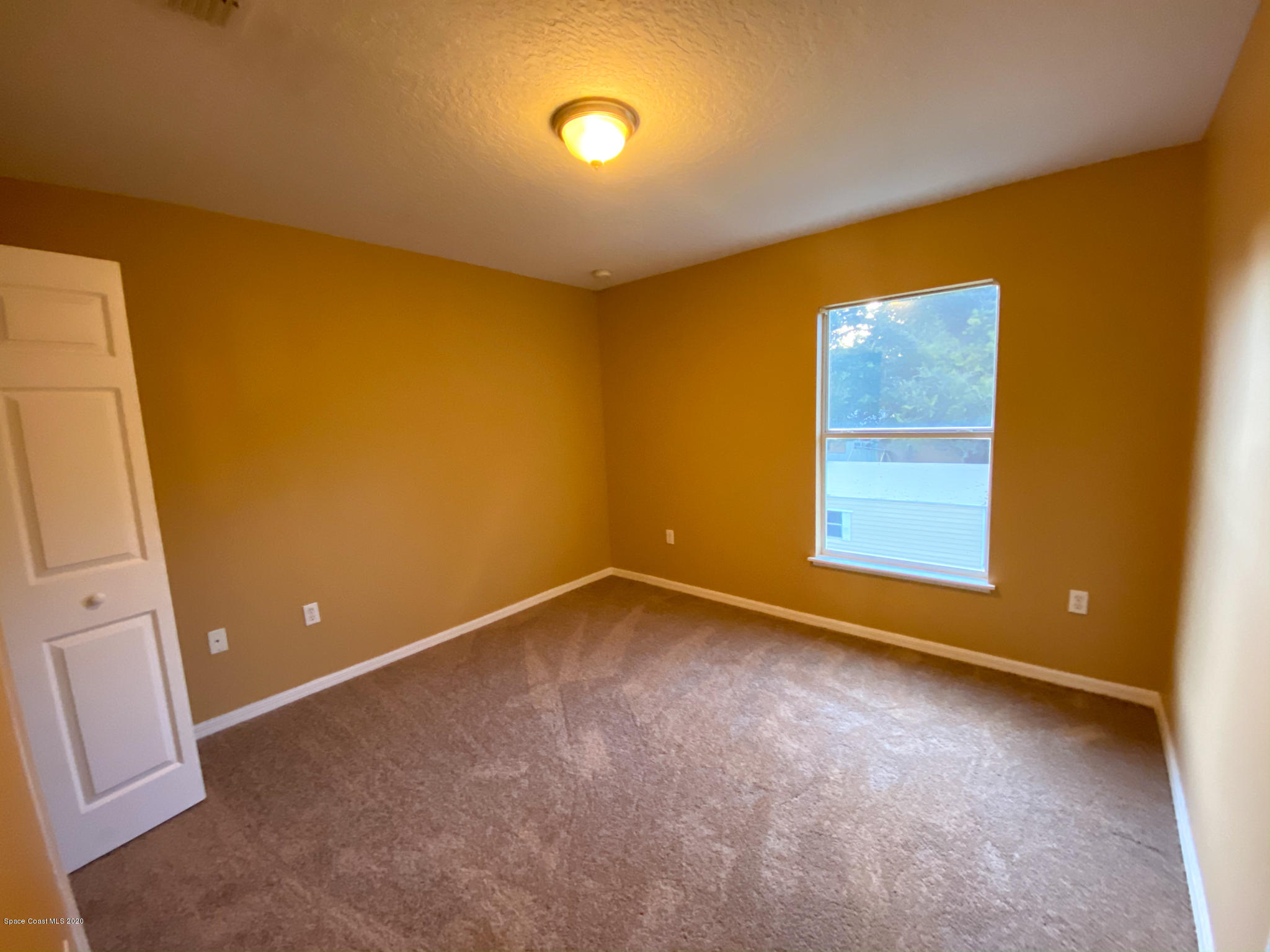 6150 Degan Road Cocoa, FL 32927 - Photo 44 of 48 a view of an empty room with a window