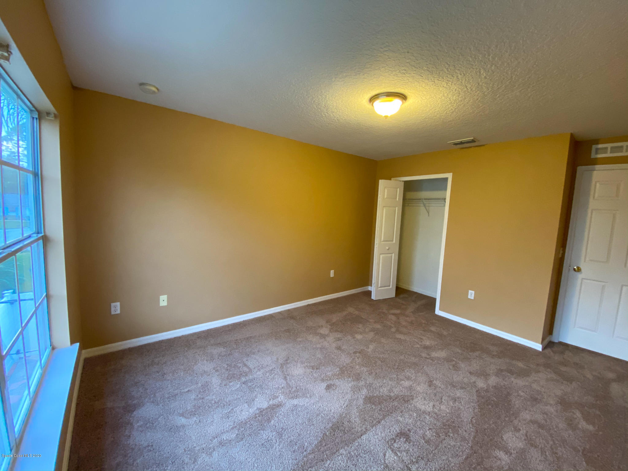 6150 Degan Road Cocoa, FL 32927 - Photo 45 of 48 a view of an empty room with a window