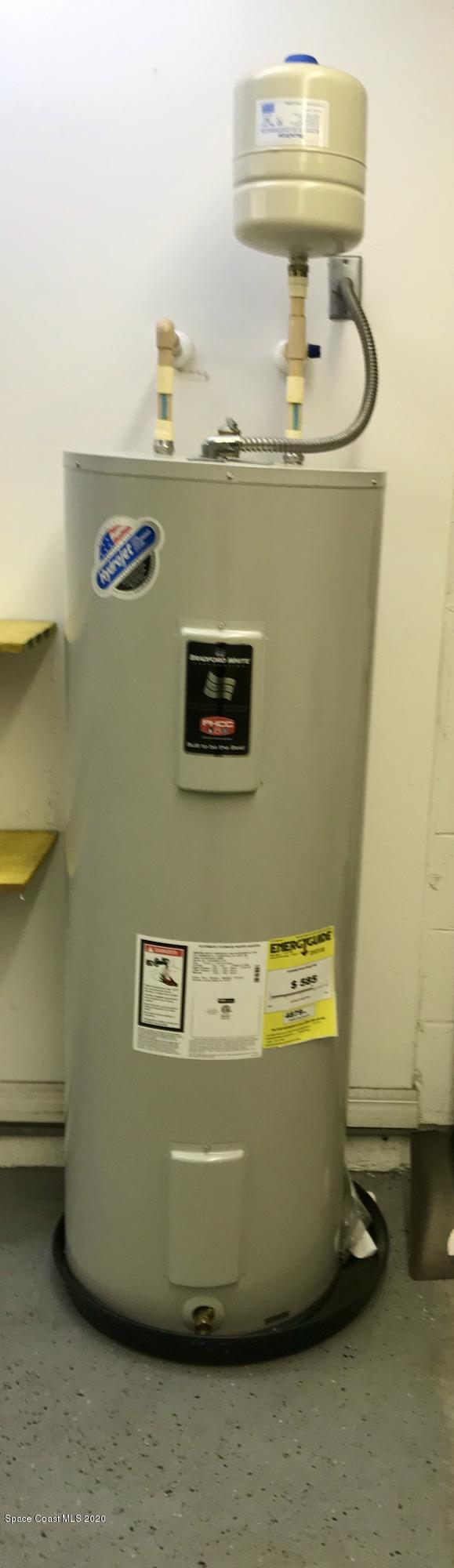 6150 Degan Road Cocoa, FL 32927 - Photo 48 of 48 a view of water heater room with washer and dryer