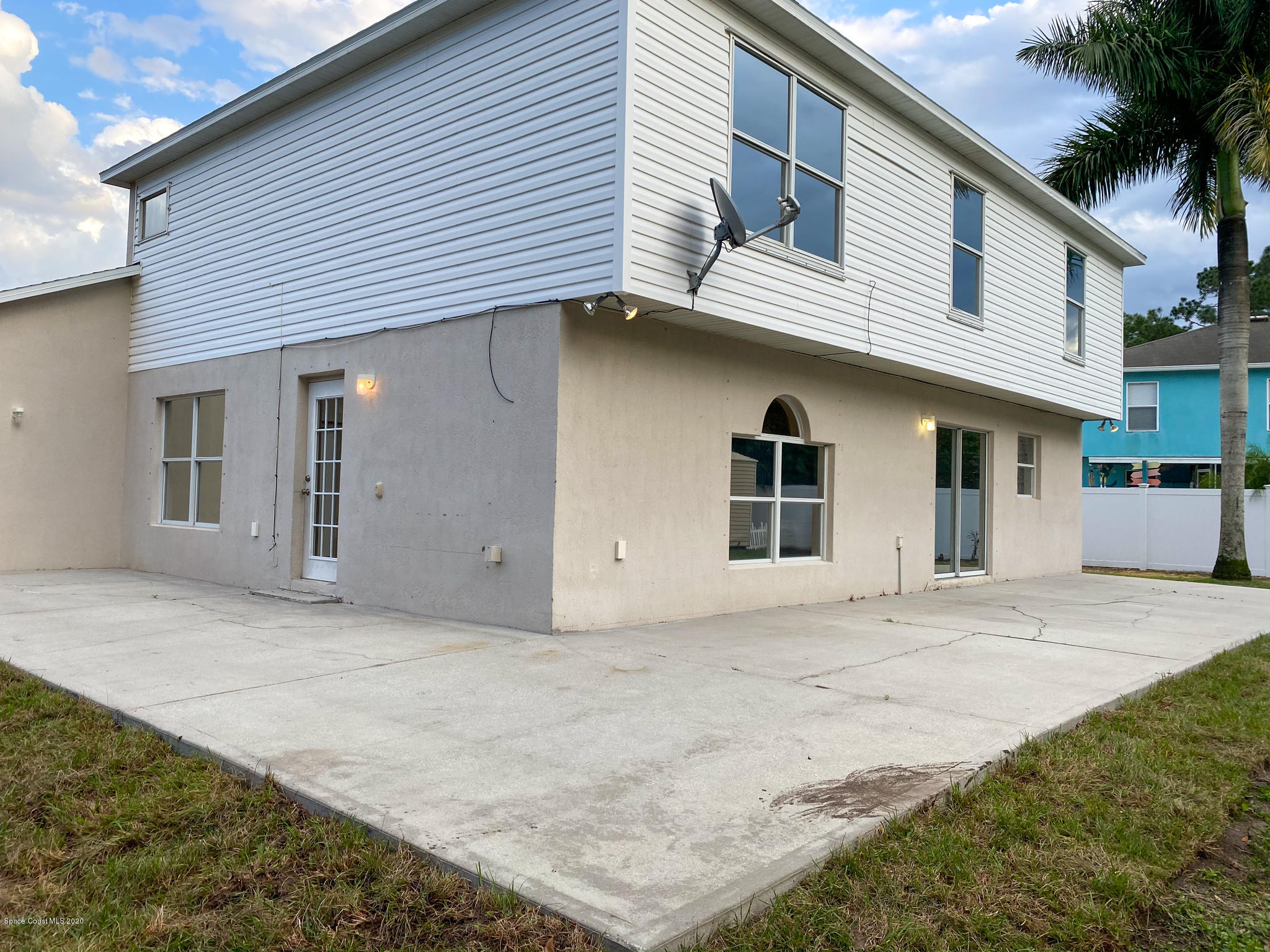 6150 Degan Road Cocoa, FL 32927 - Photo 8 of 48 a front view of a house with a garage
