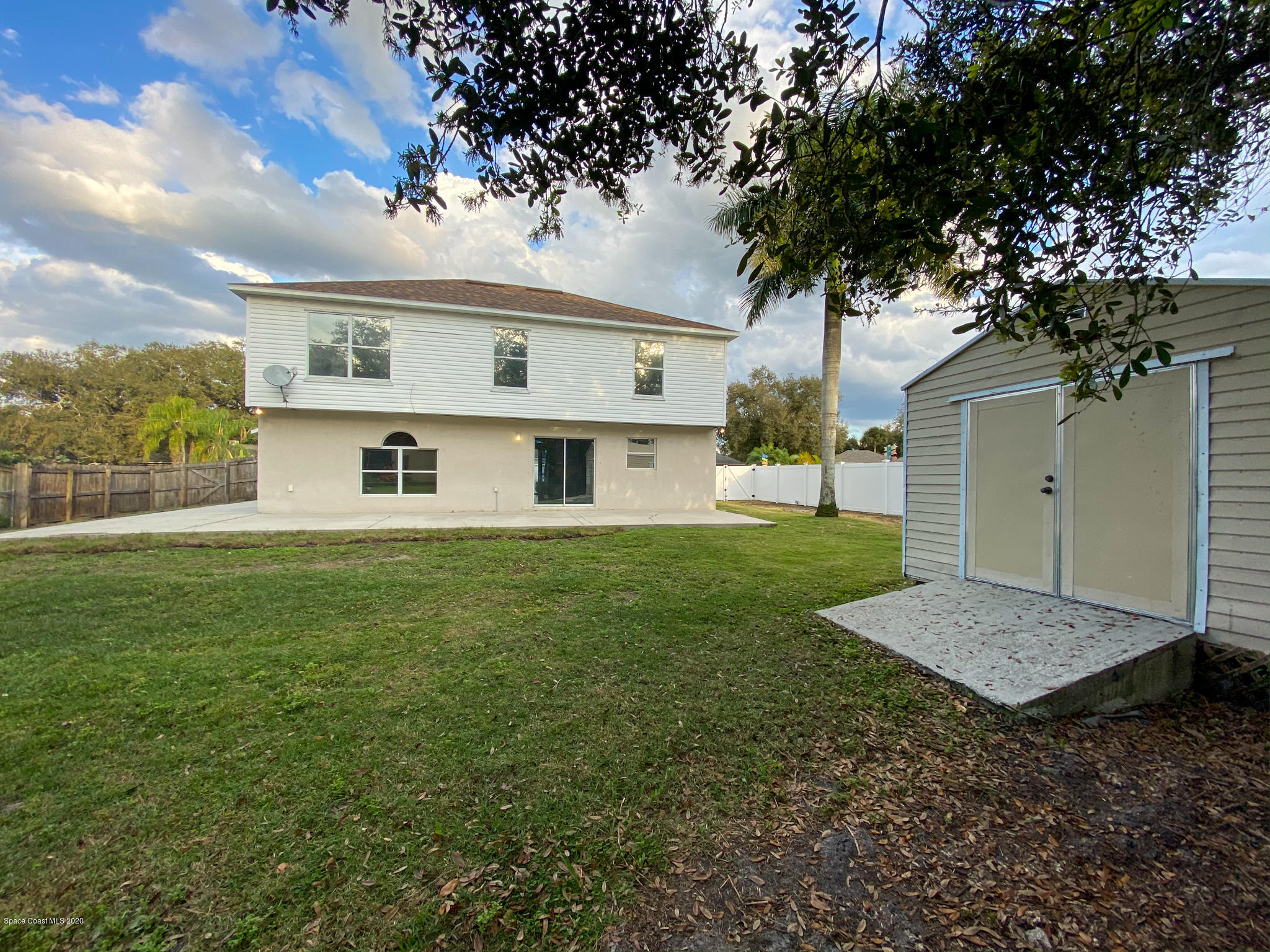6150 Degan Road Cocoa, FL 32927 - Photo 10 of 48 a front view of a house with garden