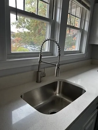 a view closeup a sink a mirror and windows