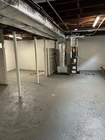 a view of an empty room with wooden roof