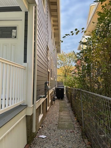 86 Aberdeen Avenue, Unit 2 Cambridge, MA 02138 - Photo 20 of 21 a view of a pathway of a house with wooden fence