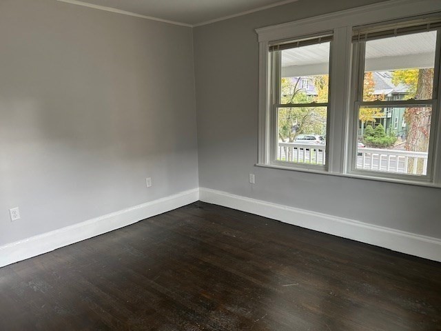 86 Aberdeen Avenue, Unit 2 Cambridge, MA 02138 - Photo 3 of 21 an empty room with wooden floor and windows