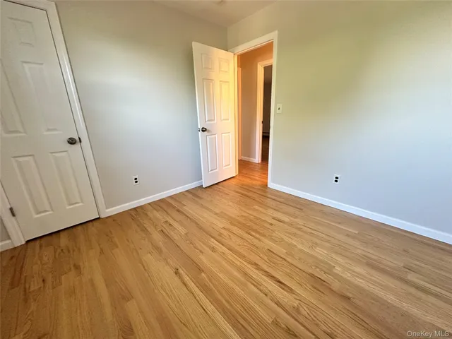 a bathroom with a sink a toilet a mirror and shower
