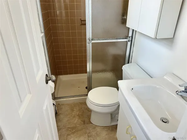 a view of a grassy field with trees