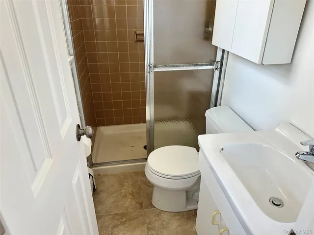 a view of a grassy field with trees