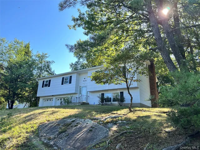 a view of a house with snow on the tree