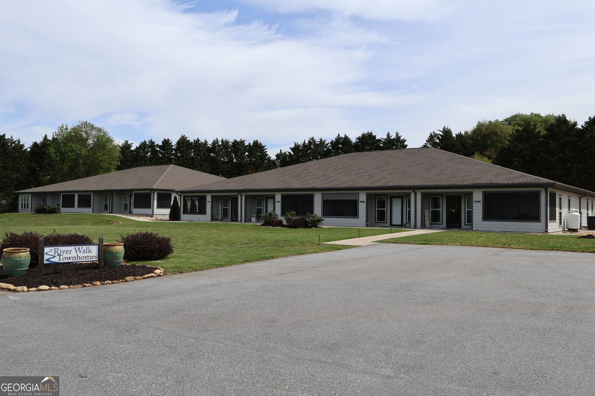 212 Old Clarkesville Mill Road, Unit C Clarkesville, GA 30523 - Photo 1 of 55 a front view of a house with a garden