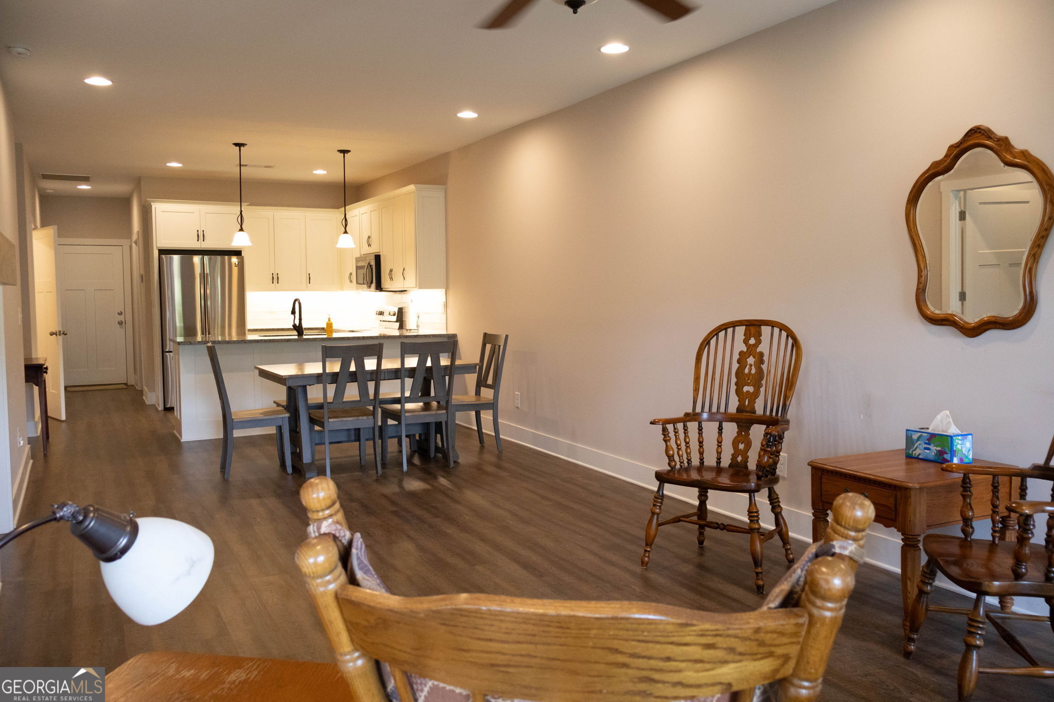 212 Old Clarkesville Mill Road, Unit C Clarkesville, GA 30523 - Photo 11 of 55 a dining room with furniture a rug and a chandelier