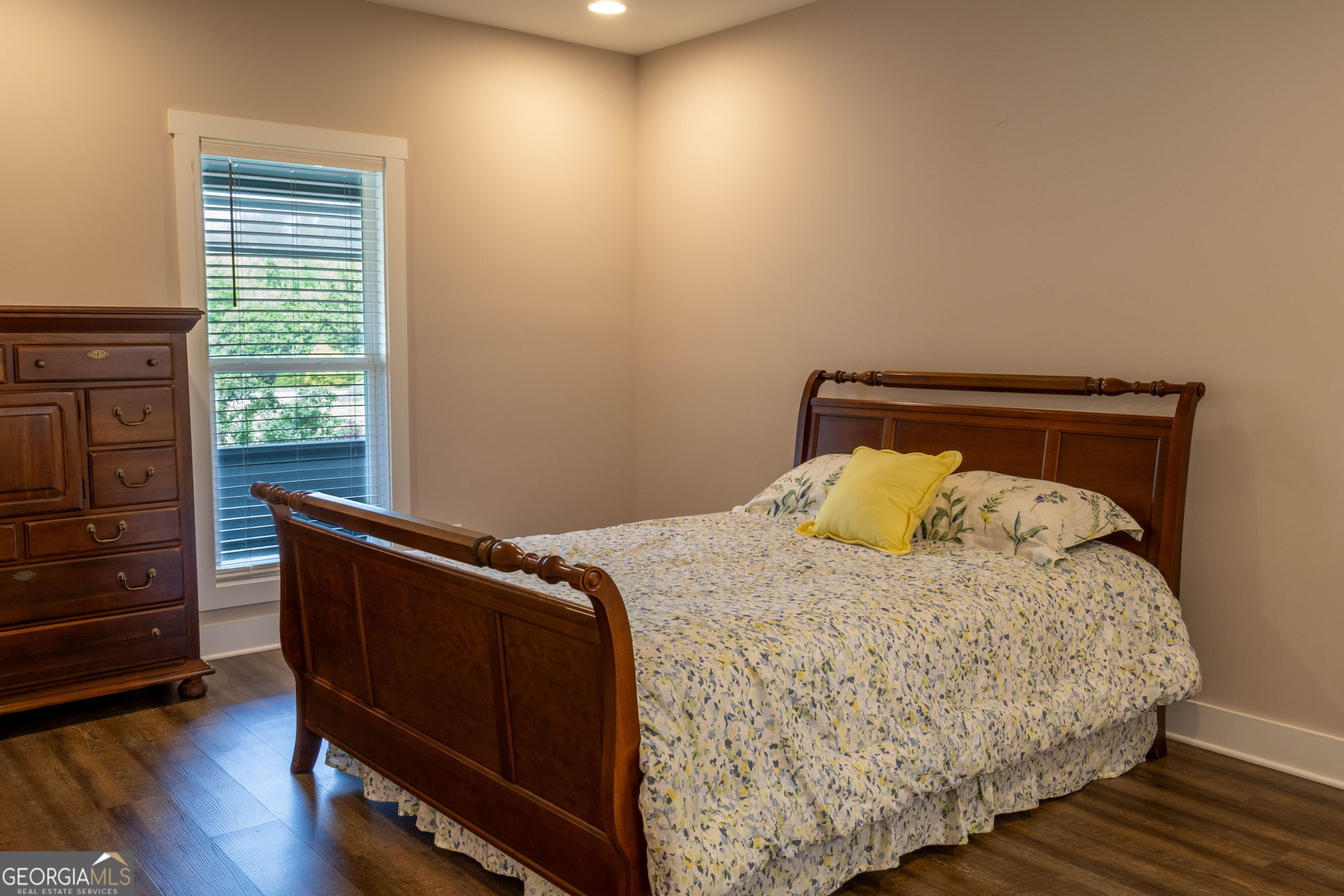 212 Old Clarkesville Mill Road, Unit C Clarkesville, GA 30523 - Photo 18 of 55 a bed sitting in a bedroom next to a window