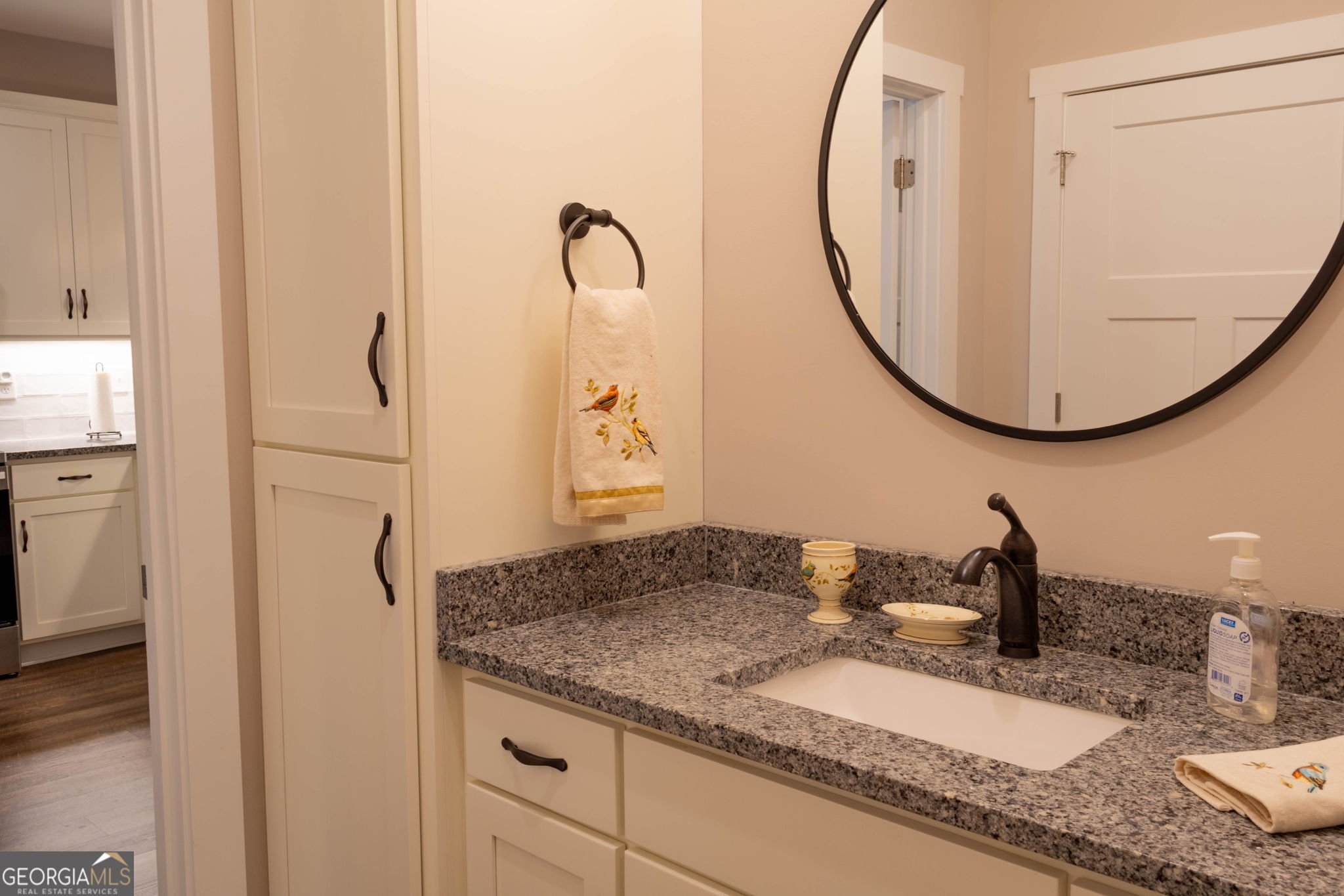 212 Old Clarkesville Mill Road, Unit C Clarkesville, GA 30523 - Photo 33 of 55 a bathroom with a granite countertop sink and a mirror